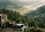 Beyond Portugal’s Coast: Finding Space to Slow Down in the Forested Interior Stone cottage terrace above forested valleys in central Portugal